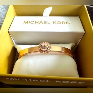 Michael Kors bangle gold with MK logo surrounded by stones